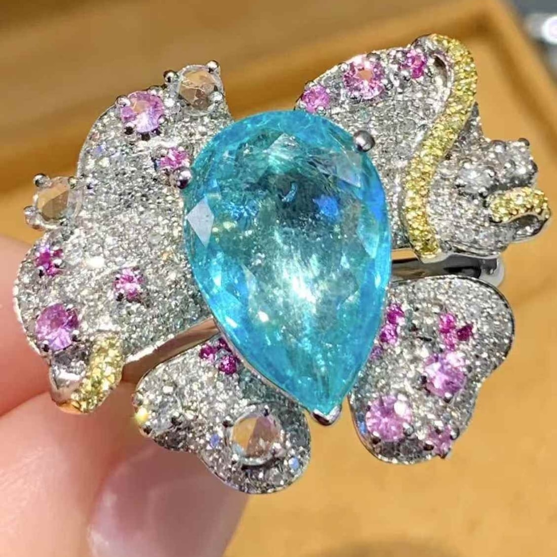 14k Gold 3.4 Ct Natural Paraiba Tourmaline & Diamond Ring: Ref:231067206 // gold content:14k gold // ring size:7. 25us // // main gemstone:paraiba tourmaline // shape:pear // carat weight:3. 4ct // color:blue // treatment:natural // // adjacent gemstone 2