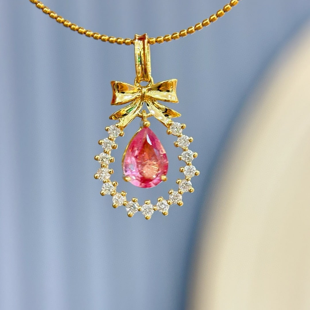 14k Gold 0.7 Ct Natural Padparadscha Sapphire & Diamond Pendant( Without Chain ): Ref:231068064 // gold content:14k gold // main gemstone:padparadscha sapphire // shape:pear // carat weight:0. 7ct // color:orangish pink // treatment:natural // // adjacent gemstone 2 : diamond //