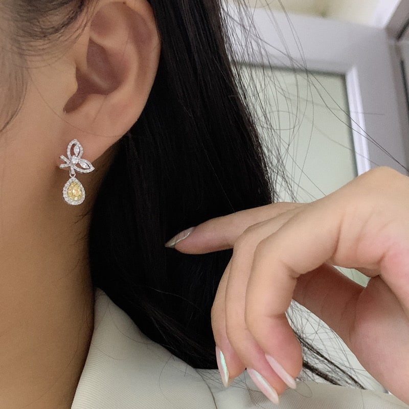 14k Gold 0.90 Ct Natural Color Diamond Earrings: Ref:231068095 // gold content:14k gold // main gemstone:diamond // shape:multiply // carat weight:0. 90ct // clarity grade:vs-si // color:color // treatment:natural // Condition: NewLow Estimate: