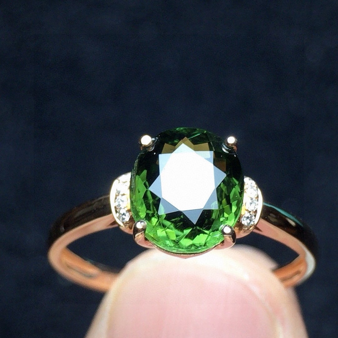 14k Gold 1.58 Ct Natural Tourmaline & Diamond Ring: Ref:231068151 // gold content:14k gold // ring size:7. 25us // // main gemstone:tourmaline // shape:oval // carat weight:1. 58ct // color:green // treatment:natural // // adjacent gemstone 2 :