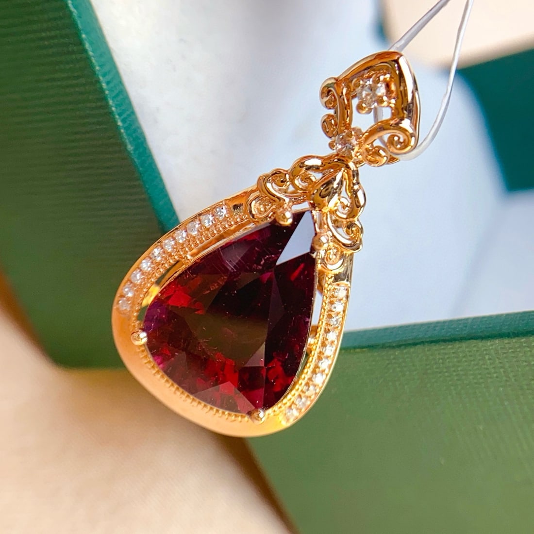 14k Gold 4.50 Ct Natural Tourmaline & Diamond & Sapphire Pendant( Without Chain ): Ref:231068171 // gold content:14k gold // main gemstone:tourmaline // shape:pear // carat weight:4. 50ct // color:red // treatment:natural // // adjacent gemstone 2 : diamond // number of stones:20