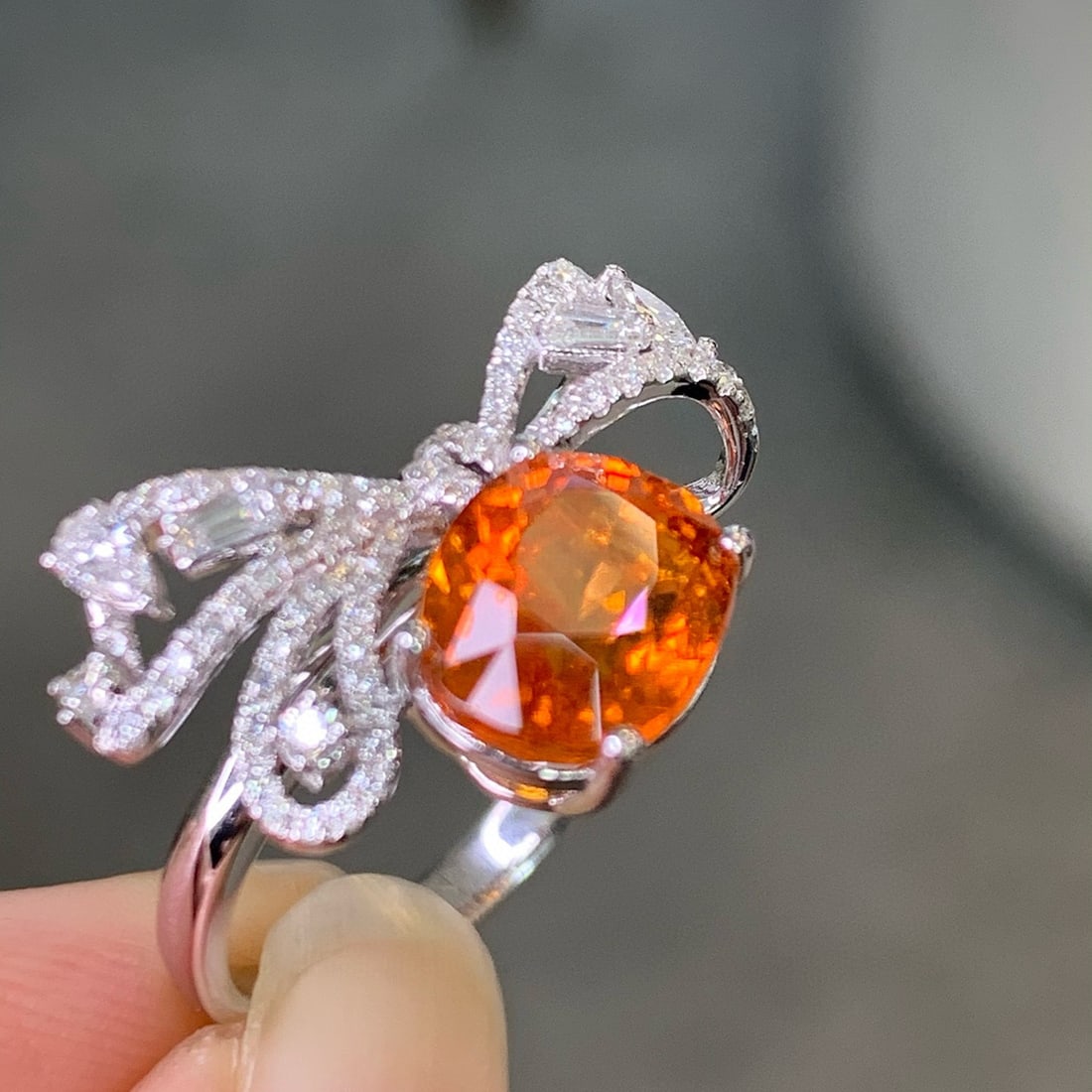 14k Gold 4.59 Ctw Natural Spessartine & Diamond Ring: Ref:231068225 // gold content:14k gold // ring size:7. 25us // // main gemstone:spessartine // shape:oval // carat weight:4. 09ct // color:orange // treatment:natural // // adjacent gemstone 2 :