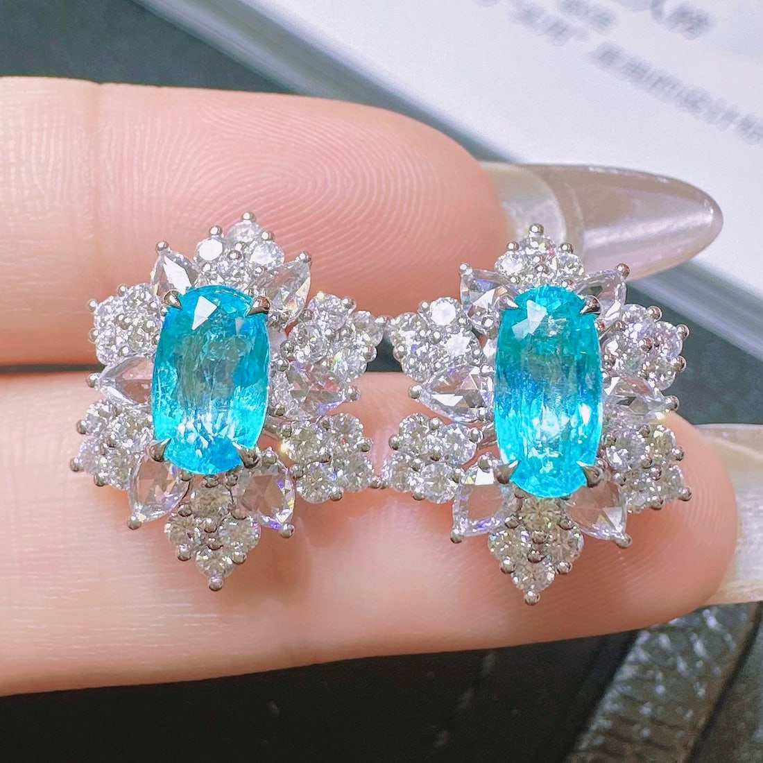 14k Gold 3.99 Ctw Natural Paraiba Tourmaline & Diamond Earrings: Ref:231068369 // gold content:14k gold // main gemstone:paraiba tourmaline // shape:oval // carat weight:2. 08ct // color:blue // treatment:natural // // adjacent gemstone 2 : diamond //