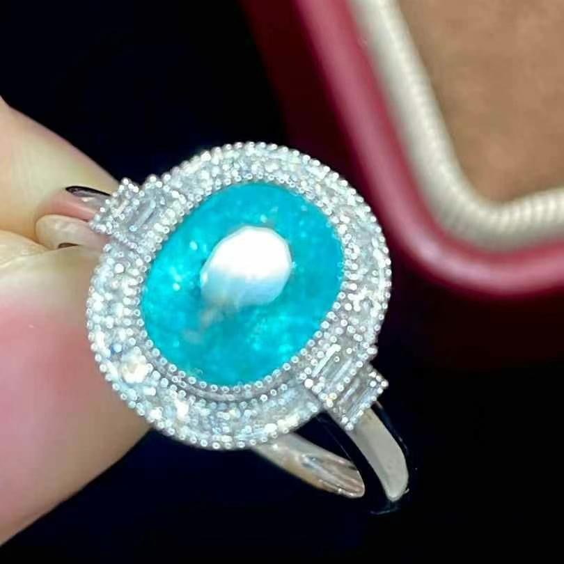 14k Gold 1.9 Ct Natural Paraiba Tourmaline & Diamond Ring: Ref:230969027 // gold content:14k gold // ring size:7. 25us // // main gemstone:paraiba tourmaline // shape:oval // carat weight:1. 9ct // color:blue // treatment:natural // // adjacent gemstone 2