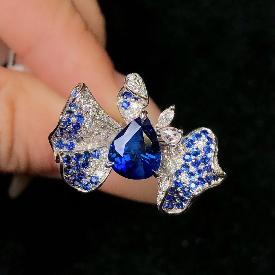 14k Gold 2.58 Ctw Natural Sapphire & Diamond Ring: Ref:230969171 // gold content:14k gold // ring size:7. 25us // // main gemstone:sapphire // shape:pear // carat weight:2. 14ct // color:royal blue // treatment:natural // // adjacent gemstone 2 :