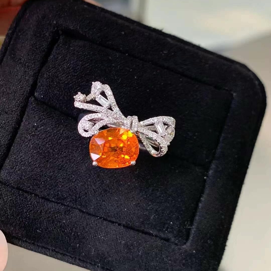 14k Gold 4.59 Ctw Natural Spessartine & Diamond Ring: Ref:230969224 // gold content:14k gold // ring size:7. 25us // // main gemstone:spessartine // shape:oval // carat weight:4. 09ct // color:orange // treatment:natural // // adjacent gemstone 2 :