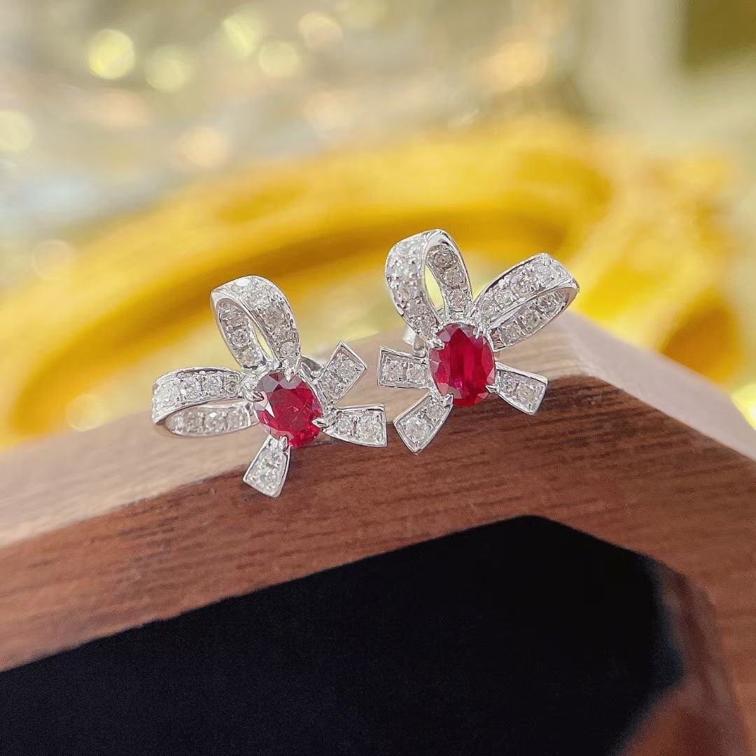 14k Gold 0.68 Ctw Natural Ruby & Diamond Earrings: Ref:230969243 // gold content:14k gold // main gemstone:ruby // shape:oval // carat weight:0. 48ct // color:red // treatment:natural // // adjacent gemstone 2 : diamond // shape:round // carat