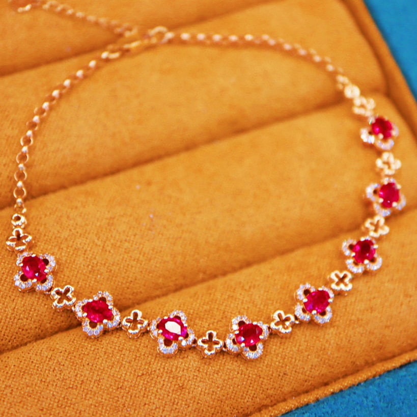 14k Gold 2.33 Ctw Natural Ruby & Diamond Bracelet: Ref:230970076 // gold content:14k gold // main gemstone:ruby // shape:oval // carat weight:1. 90ct // color:red // treatment:natural // // adjacent gemstone 2 : diamond // number of stones:144 //
