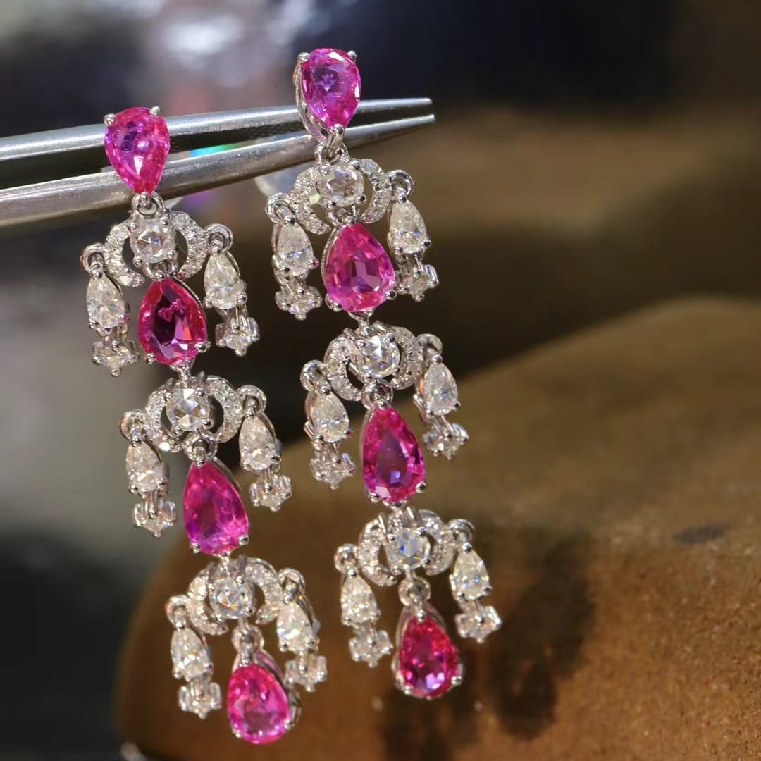 14k Gold 3.41 Ctw Natural Ruby & Diamond Earrings: Ref:230970102 // gold content:14k gold // main gemstone:ruby // shape:pear // carat weight:3. 19ct // color:red // treatment:natural // // adjacent gemstone 2 : diamond // shape:round // carat
