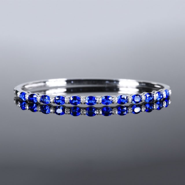 14k Gold 3.64 Ctw Natural Sapphire & Diamond Bangle: Ref:230970123 // gold content:14k gold // main gemstone:sapphire // shape:oval // carat weight:3. 53ct // color:royal blue // treatment:natural // // adjacent gemstone 2 : diamond // number of