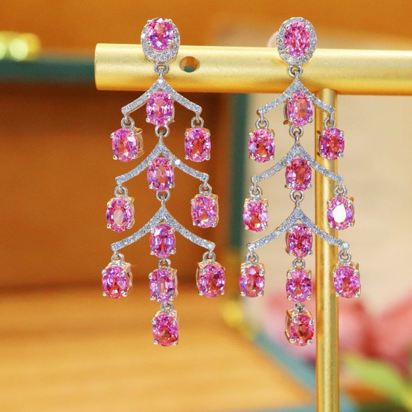 14k Gold 7.56 Ctw Natural Padparadscha Sapphire & Diamond Earrings: Ref:230970141 // gold content:14k gold // main gemstone:padparadscha sapphire // shape:oval // carat weight:7. 2ct // color:orangish pink // treatment:natural // // adjacent gemstone 2 : diamond //