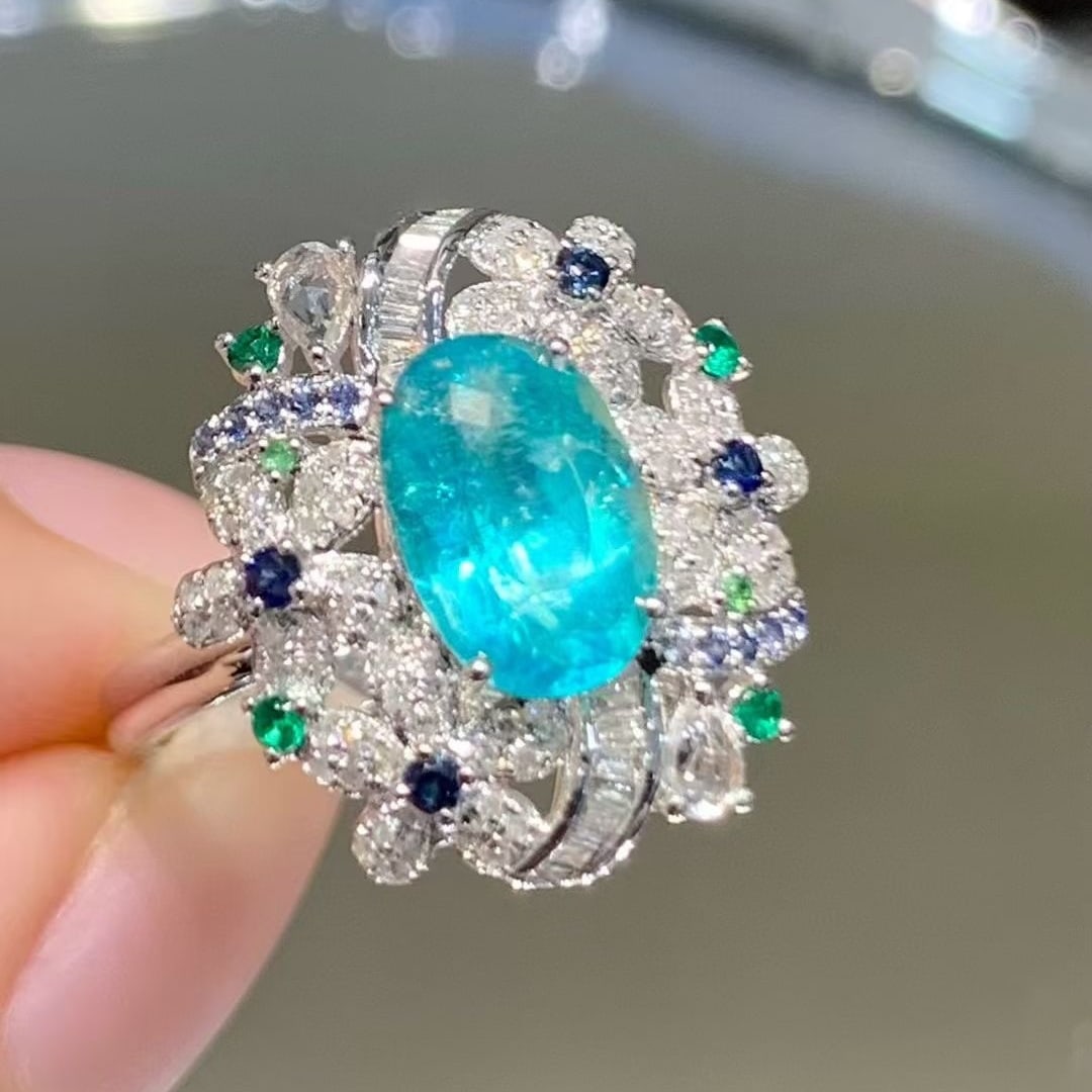 14k Gold 1.65 Ct Natural Paraiba Tourmaline & Diamond Ring: Ref:230970157 // gold content:14k gold // ring size:7. 25us // // main gemstone:paraiba tourmaline // shape:oval // carat weight:1. 65ct // color:blue // treatment:natural // // adjacent gemstone 2 :