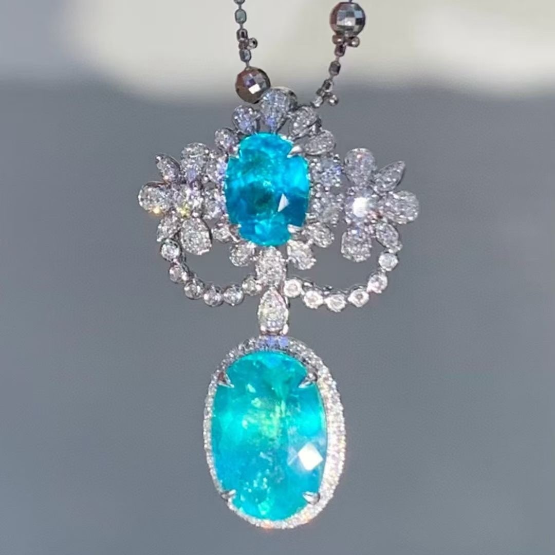 14k Gold 4.5 Ct Natural Paraiba Tourmaline & Diamond Pendant( Without Chain ): Ref:230970158 // gold content:14k gold // main gemstone:paraiba tourmaline // shape:oval // carat weight:4. 5ct // color:blue // treatment:natural // // adjacent gemstone 2 : diamond // shape:round