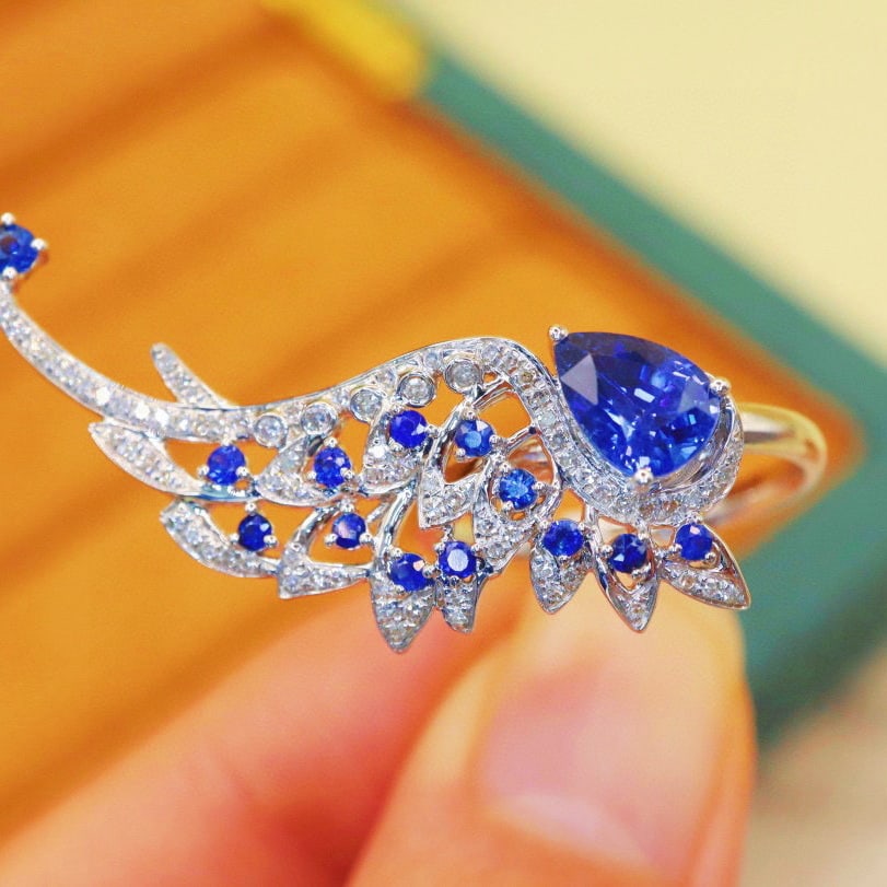 14k Gold 1.67 Ctw Natural Sapphire & Diamond Ring: Ref:230970165 // gold content:14k gold // ring size:7. 25us // // main gemstone:sapphire // shape:pear // carat weight:1. 42ct // color:royal blue // treatment:natural // // adjacent gemstone 2 :