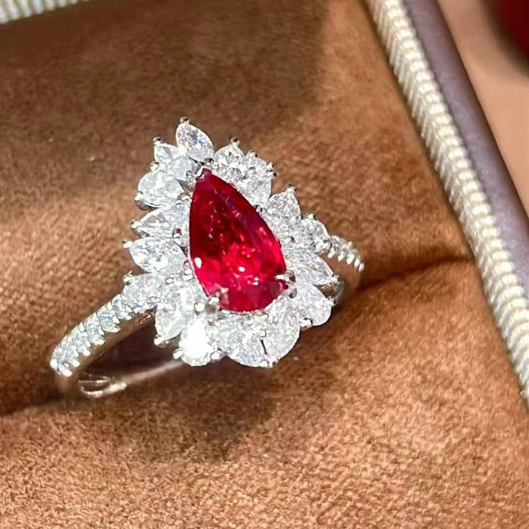 14k Gold 1.86 Ctw Natural Ruby & Diamond Ring: Ref:230970179 // gold content:14k gold // ring size:7. 25us // // main gemstone:ruby // shape:pear // carat weight:1ct // color:pigeonblood red // treatment:natural // // adjacent gemstone 2 : diamond