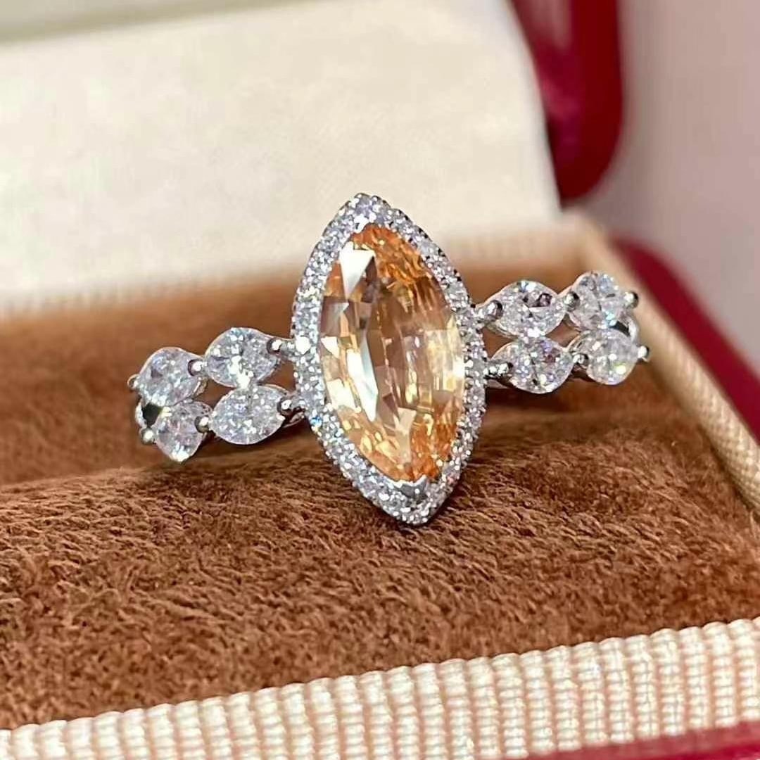 14k Gold 1.65 Ctw Natural Padparadscha Sapphire & Diamond Ring: Ref:230970241 // gold content:14k gold // ring size:7. 25us // // main gemstone:padparadscha sapphire // shape:marquise // carat weight:1. 1ct // color:pinkish orange // treatment:natural // //