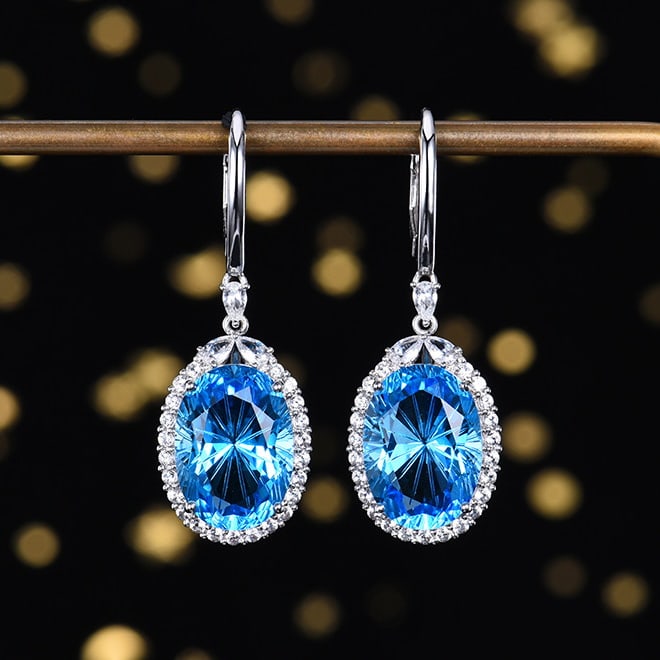 14k Gold 15.19 Ctw Natural Topaz & Sapphire Earrings: Ref:230970310 // gold content:14k gold // main gemstone:topaz // shape:oval // carat weight:14ct // color:swiss blue // treatment:natural // // adjacent gemstone 2 : sapphire // shape:multiply // cara