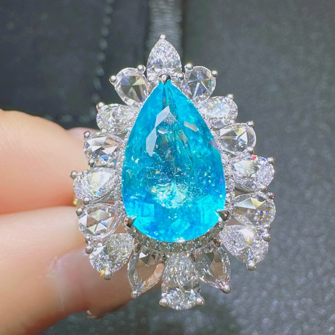 14k Gold 4.82 Ctw Natural Paraiba Tourmaline & Diamond Ring: Ref:230970325 // gold content:14k gold // ring size:7. 25us // // main gemstone:paraiba tourmaline // shape:pear // carat weight:2. 83ct // color:blue // treatment:natural // // adjacent gemstone 2 :