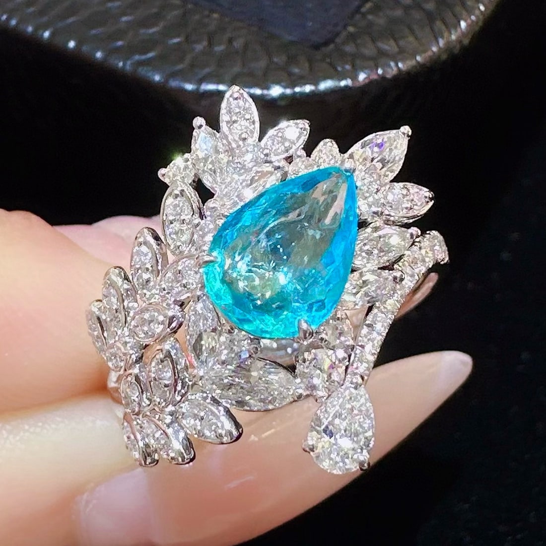 14k Gold 2.09 Ctw Natural Paraiba Tourmaline & Diamond Ring: Ref:230970350 // gold content:14k gold // ring size:7. 25us // // main gemstone:paraiba tourmaline // shape:pear // carat weight:1. 16ct // color:blue // treatment:natural // // adjacent gemstone 2 :