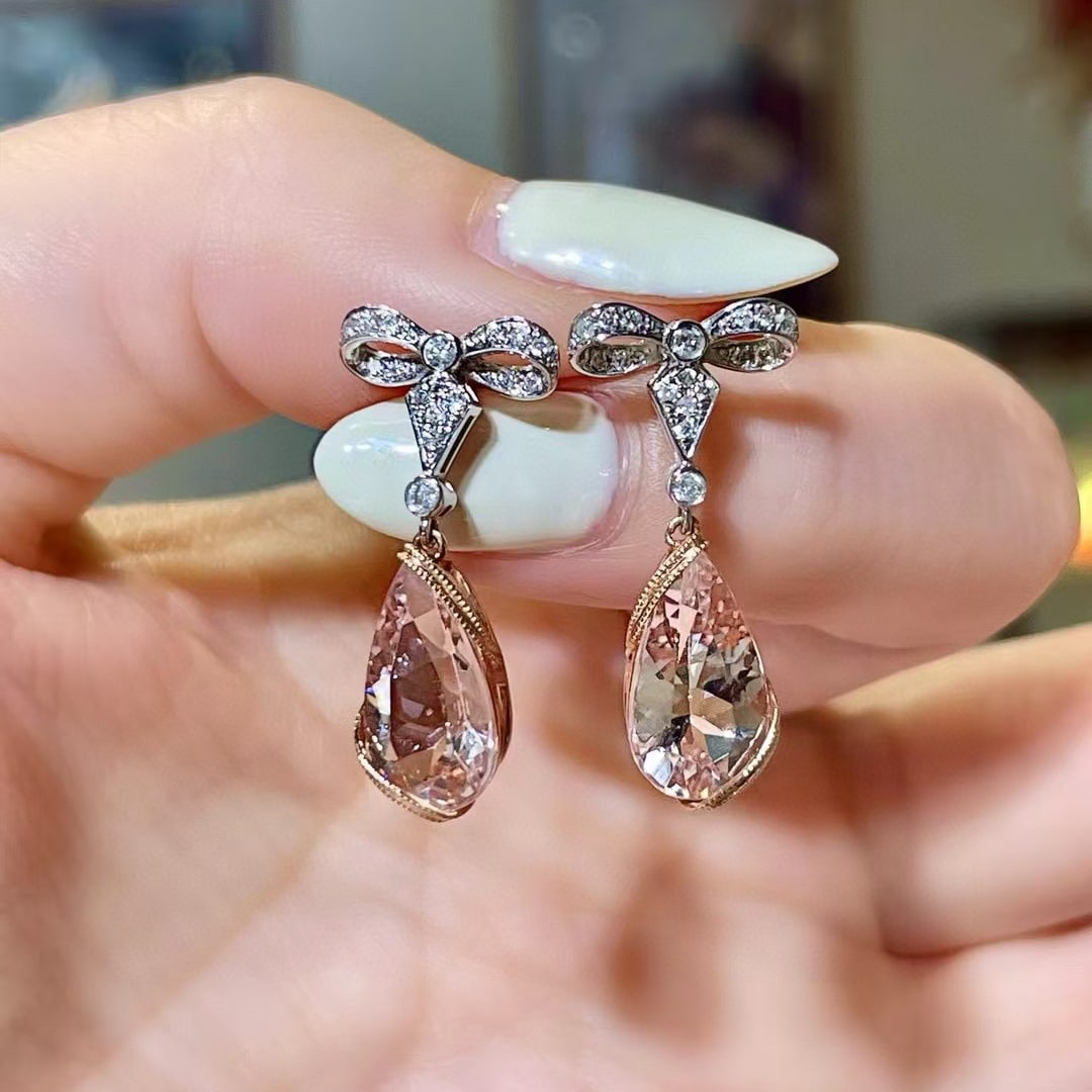 14k Gold 4.66 Ctw Natural Morganite & Diamond Earrings: Ref:230970374 // gold content:14k gold // main gemstone:morganite // shape:pear // carat weight:4. 45ct // color:pink // treatment:natural // // adjacent gemstone 2 : diamond // shape:round //