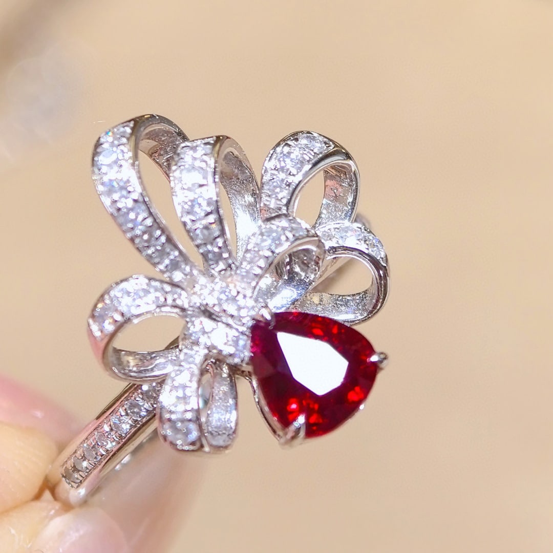 14k Gold 1.43 Ctw Natural Ruby & Diamond Ring: Ref:230970429 // gold content:14k gold // ring size:7. 25us // // main gemstone:ruby // shape:pear // carat weight:1. 05ct // color:pigeonblood red // treatment:natural // // adjacent gemstone 2 :