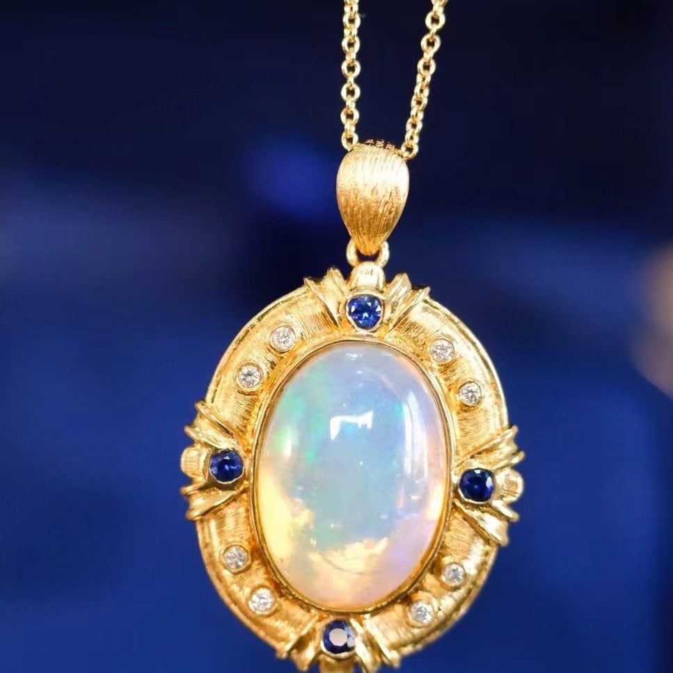14k Gold 4.37 Ct Natural Opal & Diamond & Sapphire Pendant( Without Chain ): Ref:230971006 // gold content:14k gold // main gemstone:opal // shape:oval // carat weight:4. 37ct // color:white // treatment:natural // // adjacent gemstone 2 : diamond // shape:round // clarity gra