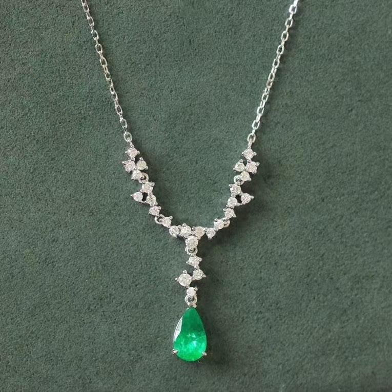14k Gold 0.86 Ctw Natural Emerald & Diamond Necklace: Ref:230971041 // gold content:14k gold // main gemstone:emerald // shape:pear // carat weight:0. 52ct // color:green // treatment:natural // // adjacent gemstone 2 : diamond // shape:round // carat