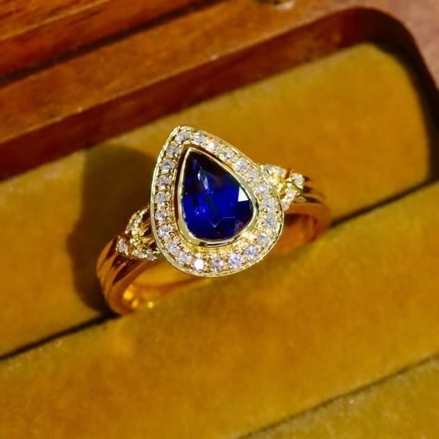 14k Gold 0.98 Ctw Vivid Blue Natural Sapphire & Diamond Ring: Ref:230971127 // gold content:14k gold // ring size:7. 25us // // main gemstone:sapphire // shape:pear // carat weight:0. 80ct // color:vivid blue // treatment:natural // // adjacent gemstone 2 :