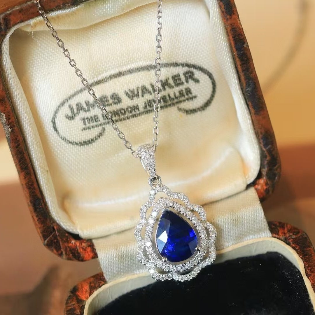 14k Gold 1.65 Ctw Natural Sapphire & Diamond Pendant( Without Chain ): Ref:230971200 // gold content:14k gold // main gemstone:sapphire // shape:pear // carat weight:1. 36ct // color:royal blue // treatment:natural // // adjacent gemstone 2 : diamond // shape:round //