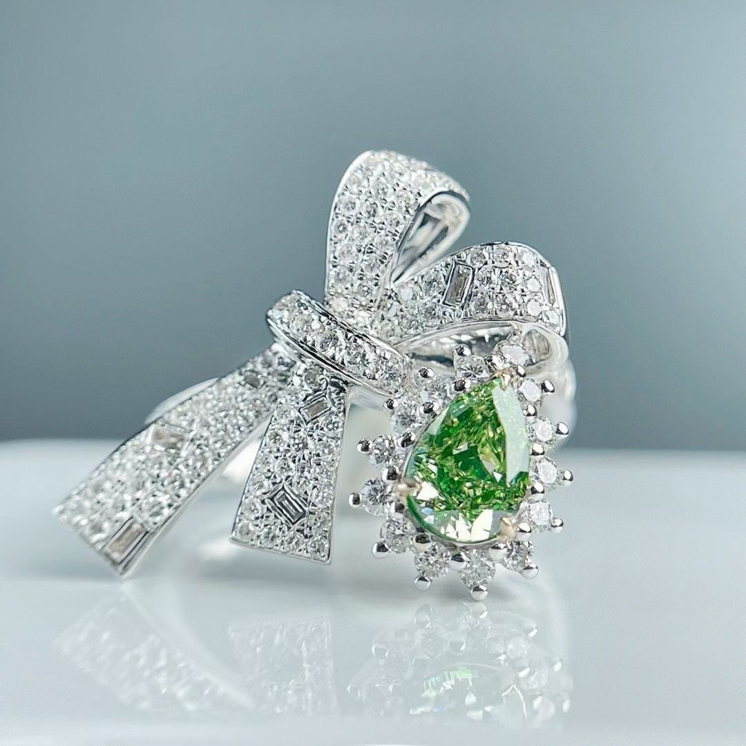 Gia Certified 14k Gold 1.27 Ctw Natural Green Diamond & Diamond Ring: Ref:230972007 // gold content:14k gold // ring size:7. 25us // // main gemstone:green diamond // certified:gia // shape:pear // carat weight:0. 64ct // clarity grade:vs1 // color:green //