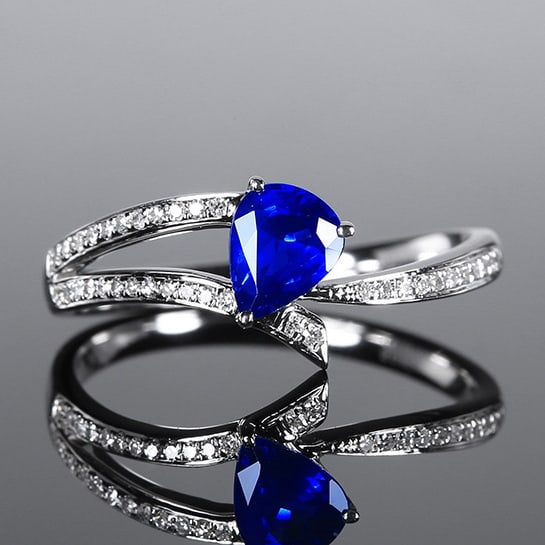 14k Gold 0.74 Ctw Natural Sapphire & Diamond Ring: Ref:230972068 // gold content:14k gold // ring size:7. 25us // // main gemstone:sapphire // shape:pear // carat weight:0. 63ct // color:royal blue // treatment:natural // // adjacent gemstone 2 :