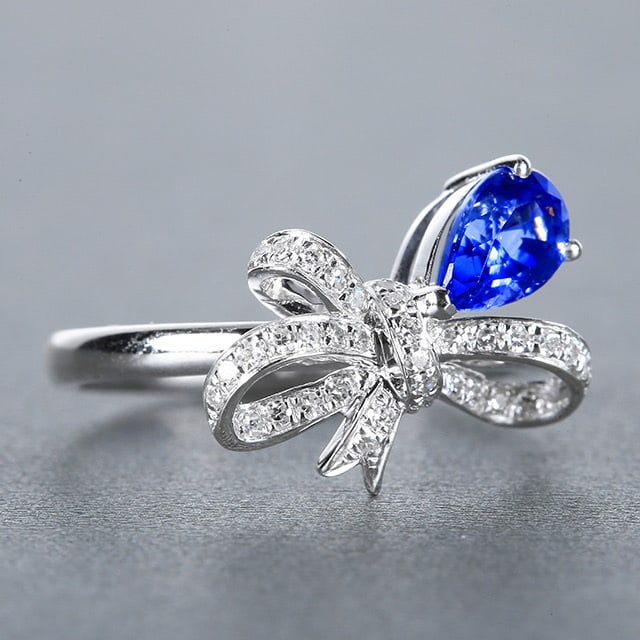 14k Gold 1.26 Ctw Natural Sapphire & Diamond Ring: Ref:230972146 // gold content:14k gold // ring size:7. 25us // // main gemstone:sapphire // shape:pear // carat weight:1. 08ct // color:royal blue // treatment:natural // // adjacent gemstone 2 :