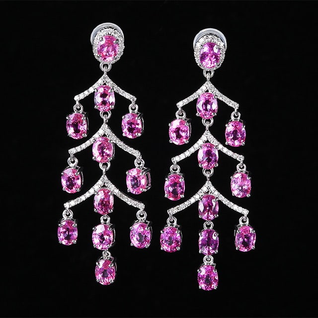 14k Gold 7.56 Ctw Natural Padparadscha Sapphire & Diamond Earrings: Ref:230972156 // gold content:14k gold // main gemstone:padparadscha sapphire // shape:oval // carat weight:7. 2ct // color:orangish pink // treatment:natural // // adjacent gemstone 2 : diamond //