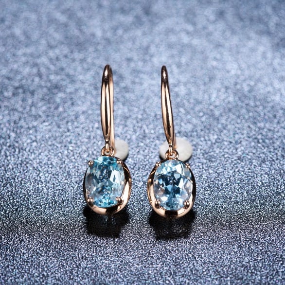 14k Gold 2.65 Ct Natural Aquamarine Earrings: Ref:230972449 // gold content:14k gold // main gemstone:aquamarine // shape:oval // carat weight:2. 65ct // color:santa maria color // treatment:natural // Condition: New Low Estimate: 2100.00 High E