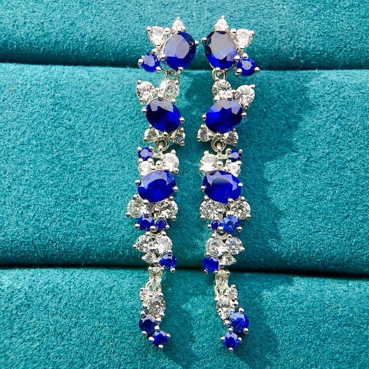 14k Gold 4.04 Ctw Natural Sapphire & Sapphire Earrings: Ref:230973003 // gold content:14k gold // main gemstone:sapphire // shape:oval // carat weight:2. 3ct // color:royal blue // treatment:natural // // adjacent gemstone 2 : sapphire // shape:round //