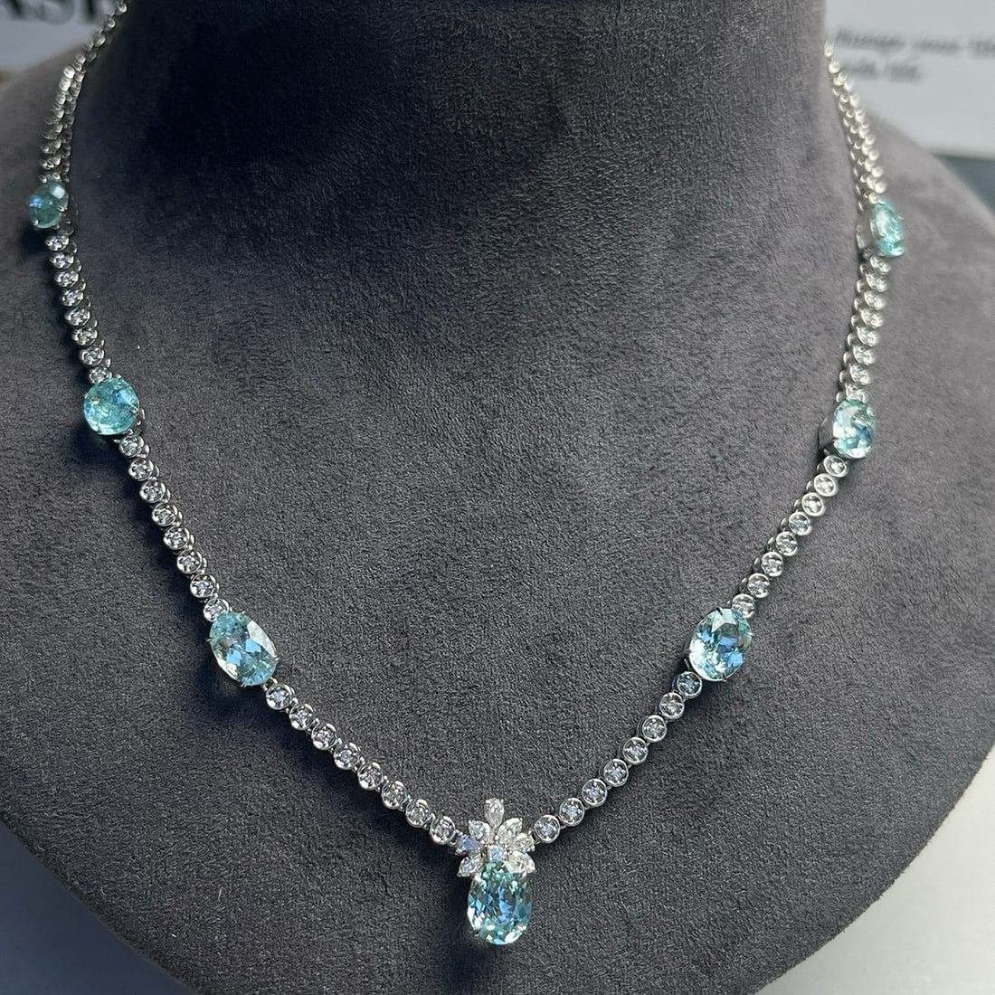 14k Gold 4.93 Ctw Natural Paraiba Tourmaline & Diamond Necklace: Ref:230973077 // gold content:14k gold // main gemstone:paraiba tourmaline // shape:oval // carat weight:4. 31ct // color:blue // treatment:natural // // adjacent gemstone 2 : diamond // shape:multipl