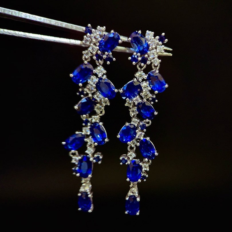 14k Gold 6.48 Ctw Vivid Blue Natural Sapphire & Sapphire Earrings: Ref:230973078 // gold content:14k gold // main gemstone:sapphire // shape:oval // carat weight:5. 75ct // color:vivid blue // treatment:natural // // adjacent gemstone 2 : sapphire // shape:round // c