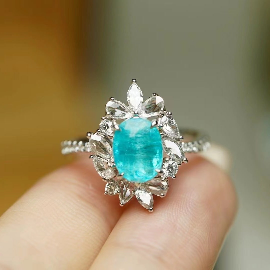 14k Gold 2.40 Ctw Natural Paraiba Tourmaline & Diamond Ring: Ref:230973092 // gold content:14k gold // ring size:7. 25us // // main gemstone:paraiba tourmaline // shape:oval // carat weight:1. 62ct // color:neon blue // treatment:natural // // adjacent gemstone