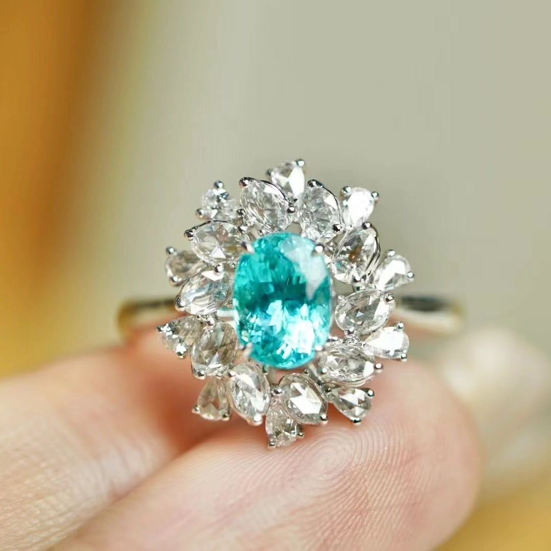 14k Gold 2.32 Ctw Natural Paraiba Tourmaline & Diamond Ring: Ref:230973187 // gold content:14k gold // ring size:7. 25us // // main gemstone:paraiba tourmaline // shape:oval // carat weight:1. 54ct // color:neon blue // treatment:natural // // adjacent gemstone