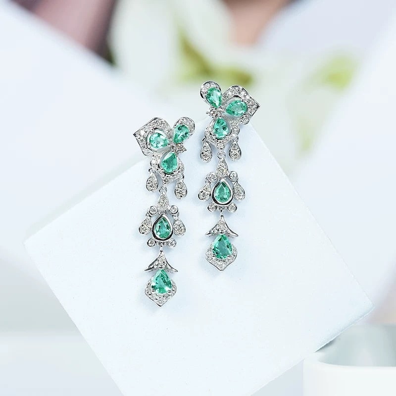 14k Gold 1.95 Ctw Natural Emerald & Diamond Earrings: Ref:230973204 // gold content:14k gold // main gemstone:emerald // shape:pear // carat weight:1. 44ct // color:green // treatment:natural // // adjacent gemstone 2 : diamond // shape:round // carat