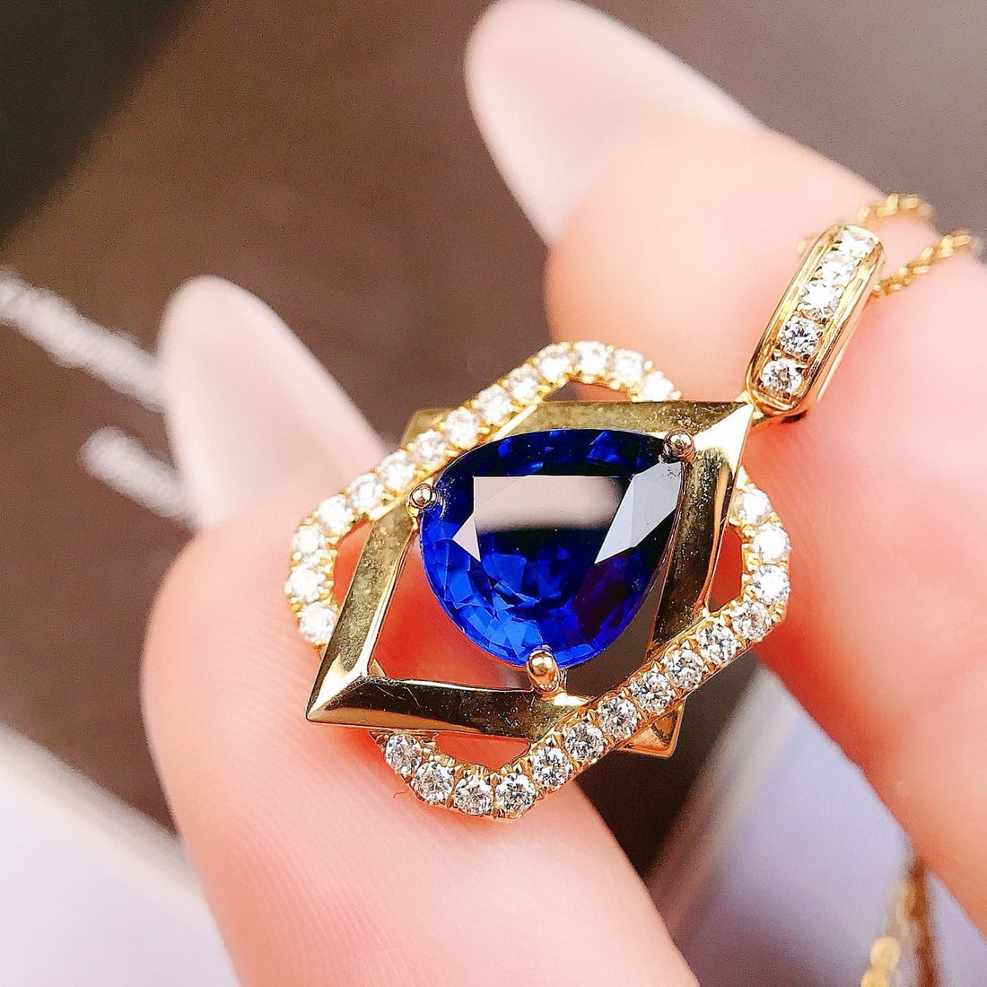 14k Gold 2.38 Ctw Natural Sapphire & Diamond Pendant( Without Chain ): Ref:230973218 // gold content:14k gold // main gemstone:sapphire // shape:pear // carat weight:2. 12ct // color:royal blue // treatment:natural // // adjacent gemstone 2 : diamond // shape:round //