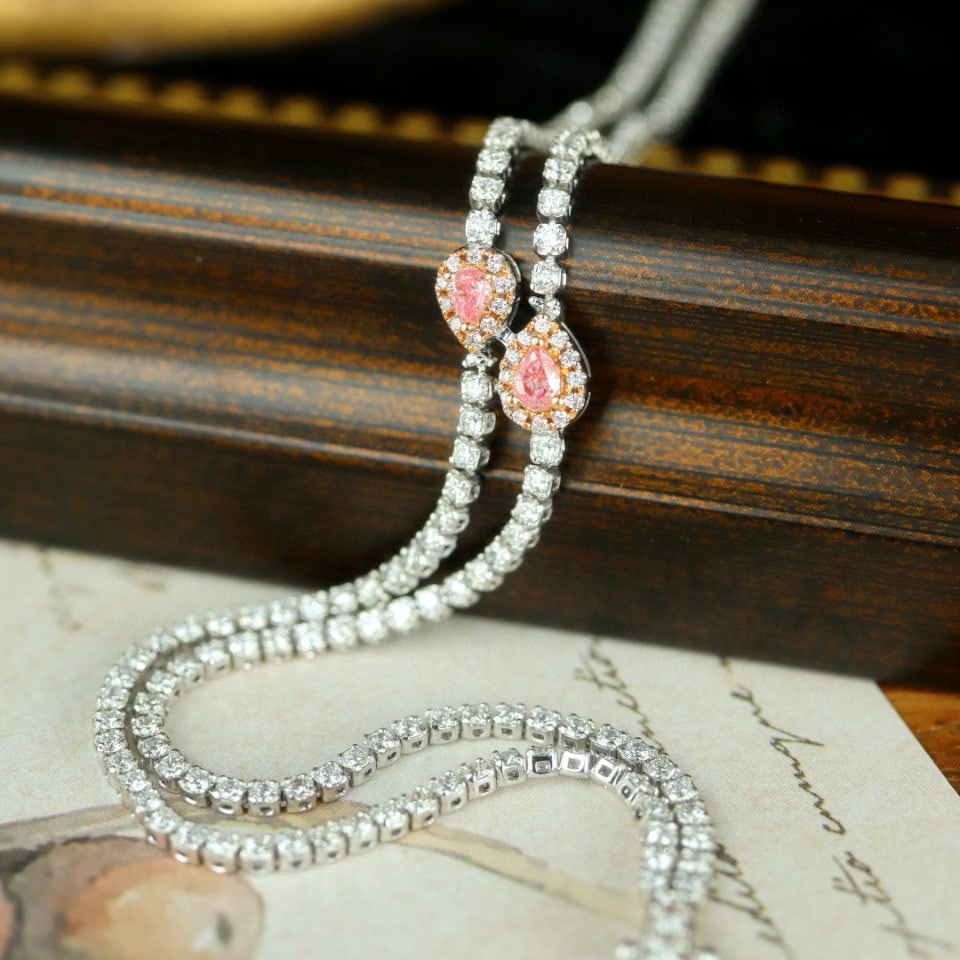 14k Gold 2.21 Ctw Natural Pink Diamond & Diamond Bracelet: Ref:230974003 // gold content:14k gold // main gemstone:pink diamond // shape:pear // carat weight:0. 13ct // color:pink // treatment:natural // // adjacent gemstone 2 : diamond // shape:round //