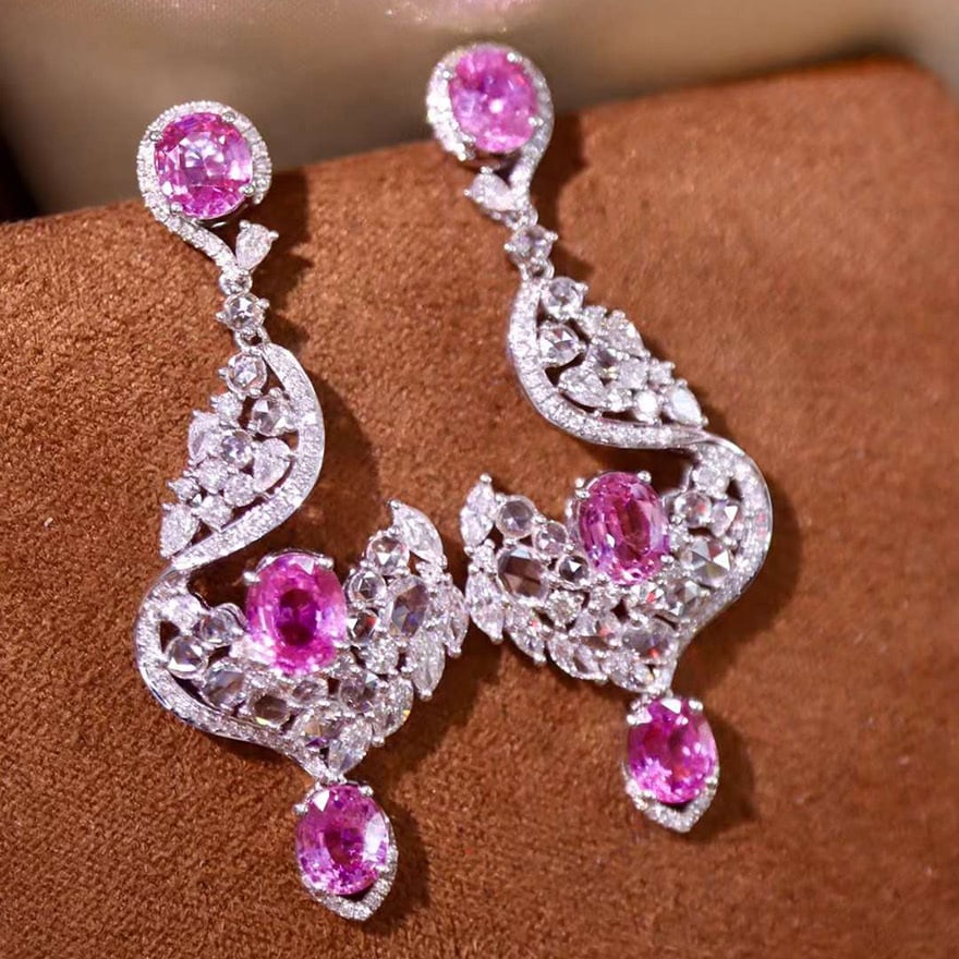 14k Gold 7.48 Ctw Natural Padparadscha Sapphire & Diamond Earrings: Ref:230974076 // gold content:14k gold // main gemstone:padparadscha sapphire // shape:oval // carat weight:4. 92ct // color:orangish pink // treatment:natural // // adjacent gemstone 2 : diamond