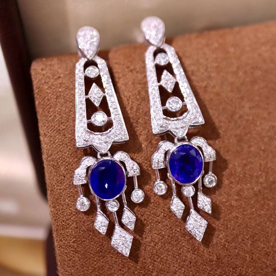 14k Gold 2.97 Ctw Vivid Blue Natural Sapphire & Diamond Earrings: Ref:230974136 // gold content:14k gold // main gemstone:sapphire // shape:oval // carat weight:2. 10ct // color:vivid blue // treatment:natural // // adjacent gemstone 2 : diamond // shape:round //
