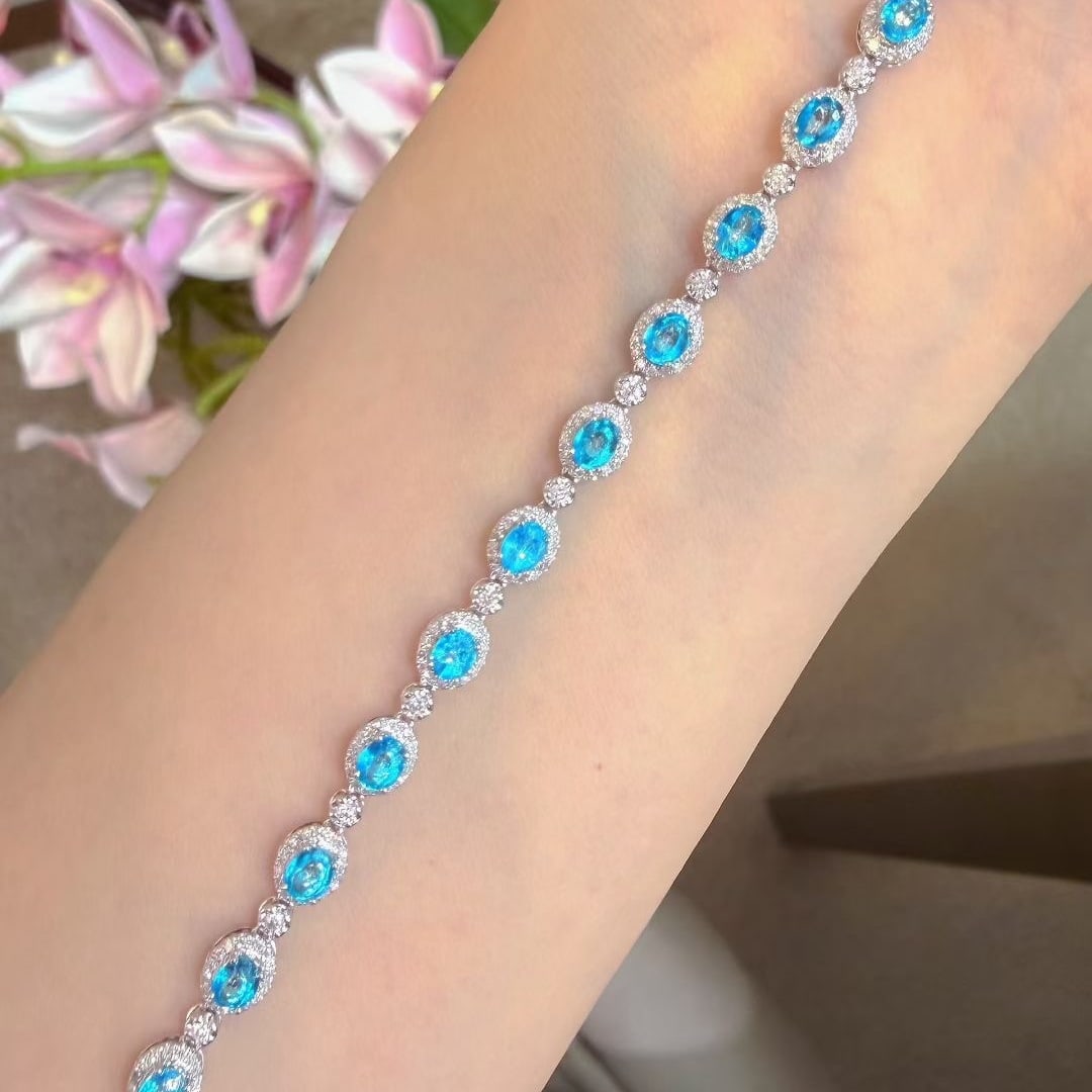 14k Gold 3.1 Ct Natural Paraiba Tourmaline & Diamond Bracelet: Ref:231131050 // gold content:14k gold // main gemstone:paraiba tourmaline // shape:oval // carat weight:3. 1ct // color:blue // treatment:natural // // adjacent gemstone 2 : diamond // shape:round //