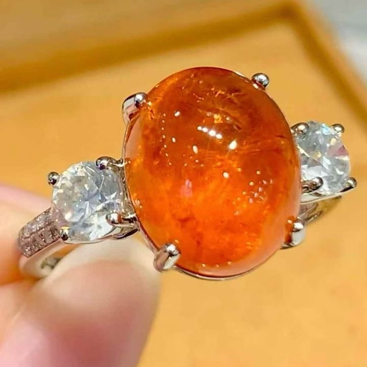 14k Gold 8.2 Ctw Natural Spessartine & Diamond Ring: Ref:231131053 // gold content:14k gold // ring size:7. 25us // // main gemstone:spessartine // shape:oval // carat weight:7. 5ct // color:orange // treatment:natural // // adjacent gemstone 2 :