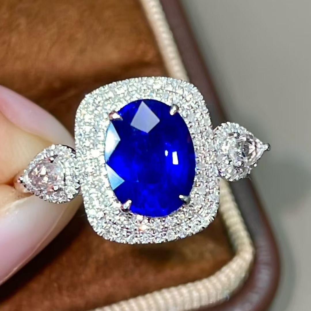 14k Gold 2.48 Ctw Natural Sapphire & Diamond Ring: Ref:231131070 // gold content:14k gold // ring size:7. 25us // // main gemstone:sapphire // shape:oval // carat weight:2. 18ct // color:blue // treatment:natural // // adjacent gemstone 2 :