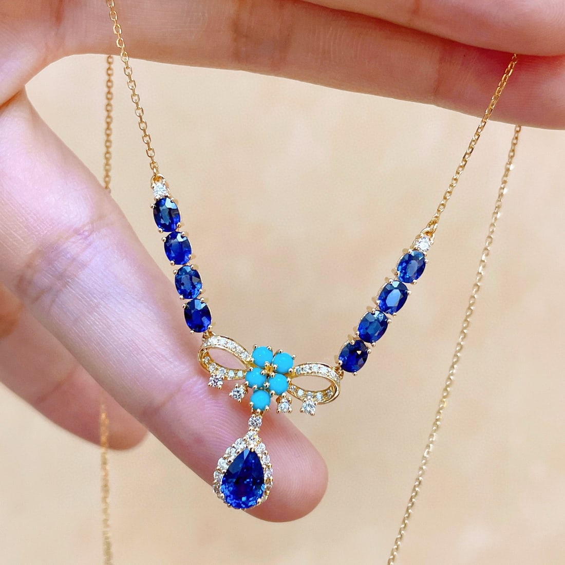 14k Gold 3.35 Ctw Natural Sapphire & Sapphire Necklace: Ref:231131112 // gold content:14k gold // main gemstone:sapphire // shape:pear // carat weight:1. 15ct // color:blue // treatment:natural // // adjacent gemstone 2 : sapphire // shape:oval // carat