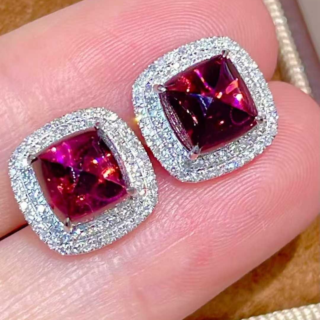 14k Gold 4.15 Ct Natural Tourmaline & Diamond Earrings: Ref:231131232 // gold content:14k gold // main gemstone:tourmaline // shape:sugar-loaf // carat weight:4. 15ct // color:red // treatment:natural // // adjacent gemstone 2 : diamond // shape:round // c