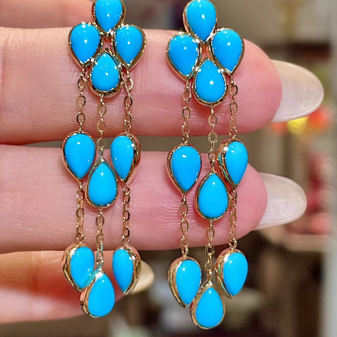 14k Gold 8.0 Ct Natural Blue Turquoise Earrings: Ref:231132149 // gold content:14k gold // main gemstone:blue turquoise // shape:pear // carat weight:8. 0ct // color:blue // treatment:natural // Low Estimate: 5500 Condition: New High Estimate: 8300